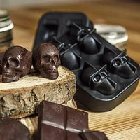 Detailed 3D skull-shaped silicone ice cube tray in a vibrant color, perfect for creating spooky, fun ice cubes for drinks.