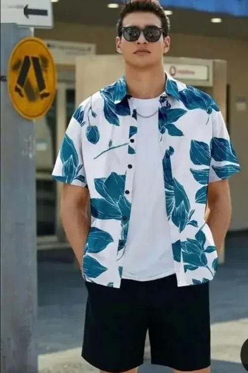 Men's Printed Casual Shirt – Stylish Half Sleeves Regular Fit in white with blue leaf patterns worn by man outdoors