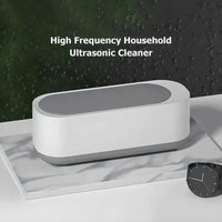 Mini Ultrasonic Jewelry Cleaner Machine in white with gray top for cleaning jewelry and small items at home.