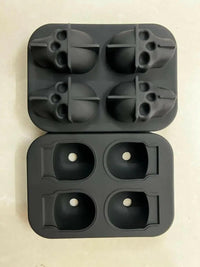 Chilling 3D skull-shaped silicone ice cube tray in a sleek design, perfect for spooky drinks or themed parties.